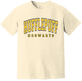 Beige t-shirt with 'Hufflepuff Hogwarts' text in yellow and black on a white background