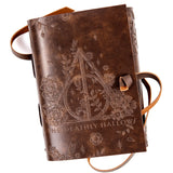 Brown leather-bound book with embossed design and 'The Deathly Hallows' text on a white background